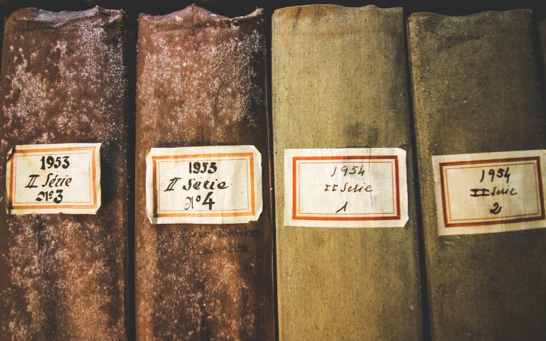 What Is a Mold Allergy? four book spines with mold on them