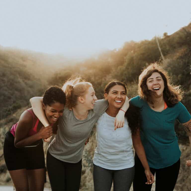Group of happy friends on a hiking trail